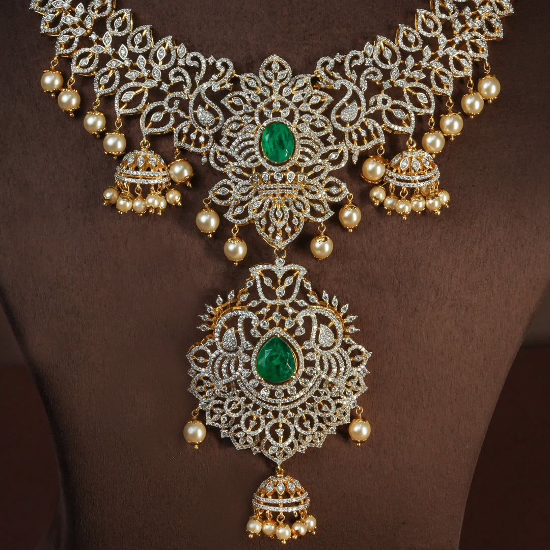Close-up of handcrafted designer 92.5 silver cz emerald necklace with premium cz and semi precious emerald embellishments . Perfect for bridal wear, festive occasions, weddings, and traditional ethnic styling.
Sri fine jewellery, Hyderabad. 