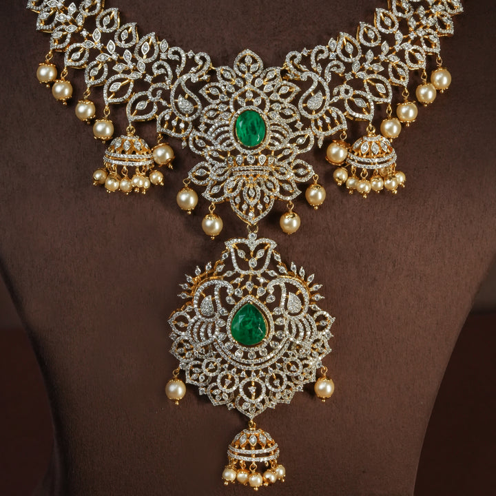 Close-up of handcrafted designer 92.5 silver cz emerald necklace with premium cz and semi precious emerald embellishments . Perfect for bridal wear, festive occasions, weddings, and traditional ethnic styling.
Sri fine jewellery, Hyderabad. 