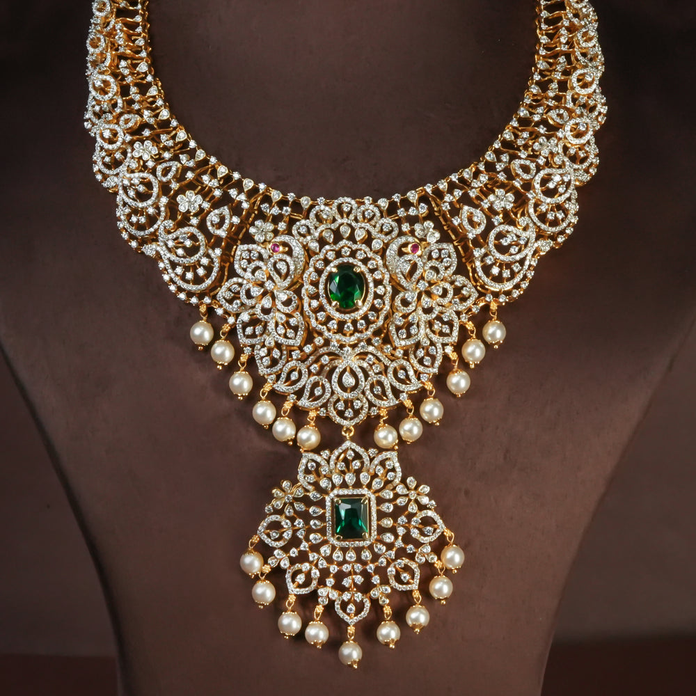 Handcrafted designer 92.5 silver cz emerald necklace with premium cz and semi precious emerald embellishments . Perfect for bridal wear, festive occasions, weddings, and traditional ethnic styling.
Sri fine jewellery, Hyderabad. 