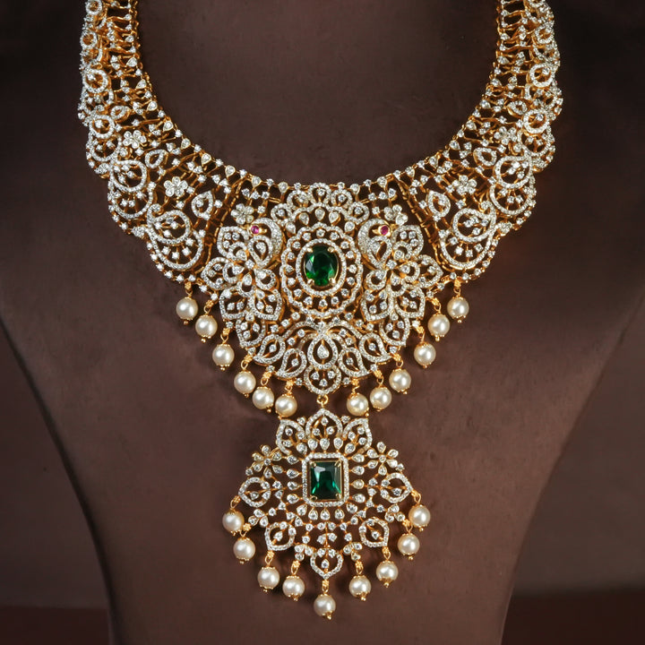 Handcrafted designer 92.5 silver cz emerald necklace with premium cz and semi precious emerald embellishments . Perfect for bridal wear, festive occasions, weddings, and traditional ethnic styling.
Sri fine jewellery, Hyderabad. 