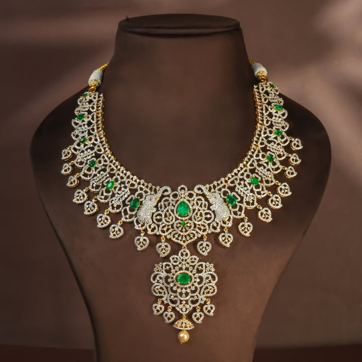 Handcrafted designer 92.5 silver cz emerald necklace with premium cz embellishments, elephant motifs. Perfect for bridal wear, festive occasions, weddings, and traditional ethnic styling.
Sri fine jewellery, Hyderabad. 