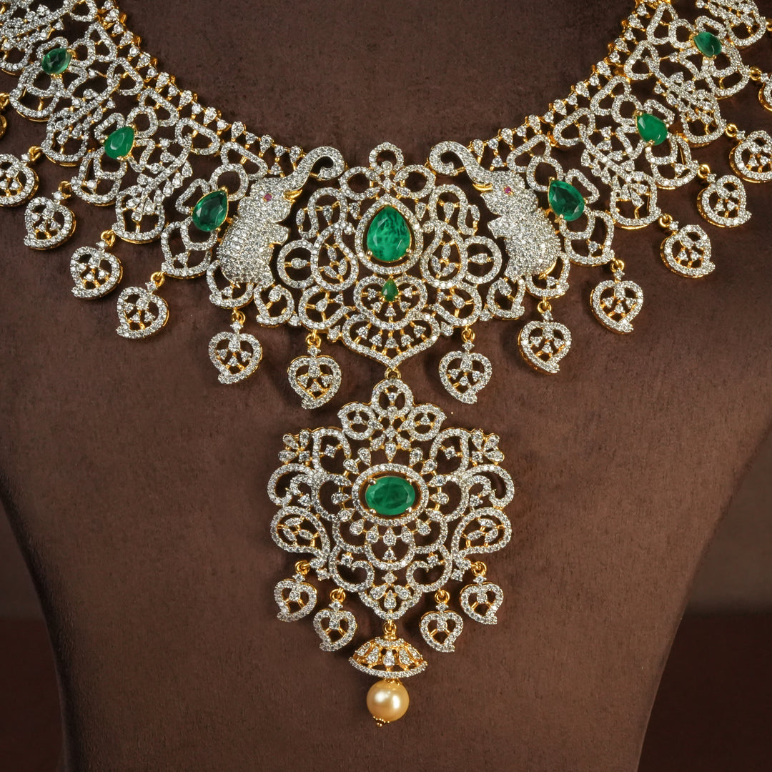 Close-up view of handcrafted designer 92.5 silver cz emerald necklace with premium cz embellishments, elephant motifs. Perfect for bridal wear, festive occasions, weddings, and traditional ethnic styling.
Sri fine jewellery, Hyderabad. 