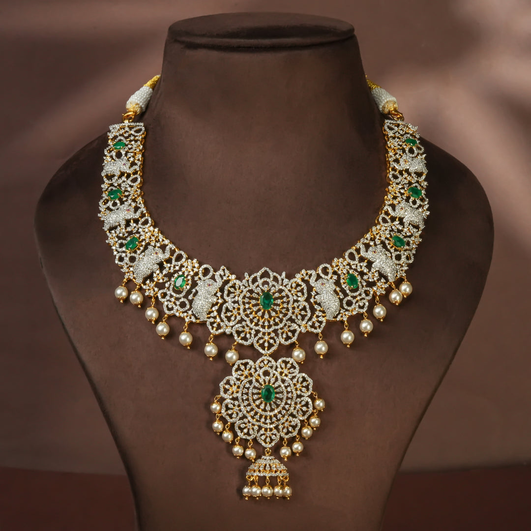 Handcrafted designer 92.5 silver cz emerald necklace with premium cz embellishments, elephant motifs. Perfect for bridal wear, festive occasions, weddings, and traditional ethnic styling.
Sri fine jewellery, Hyderabad. 