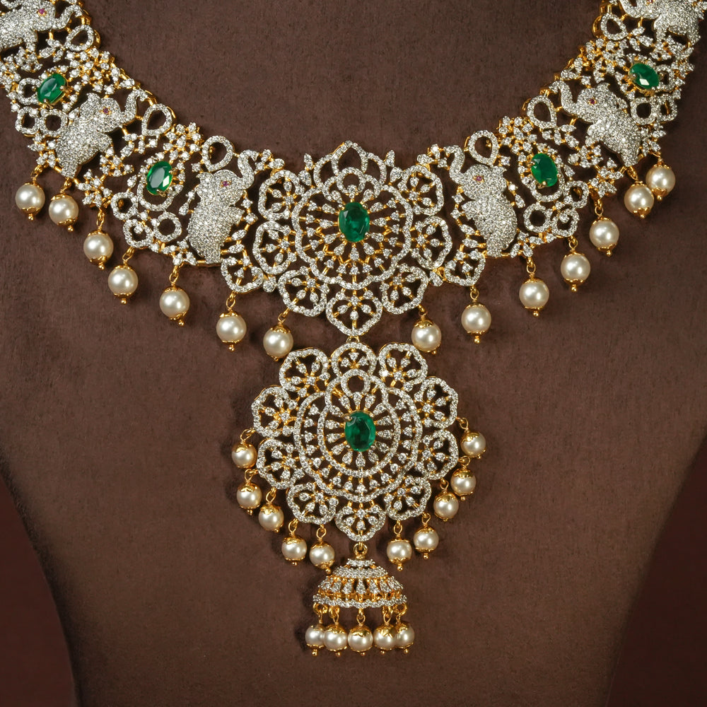 Close-up view of handcrafted designer 92.5 silver cz emerald necklace with premium cz embellishments, elephant motifs. Perfect for bridal wear, festive occasions, weddings, and traditional ethnic styling.
Sri fine jewellery, Hyderabad. 