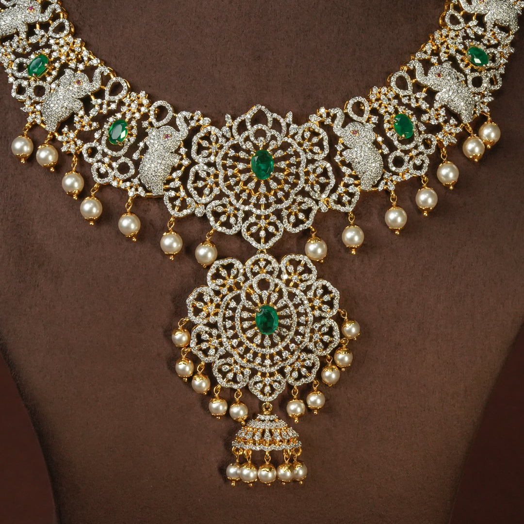 Close-up view of handcrafted designer 92.5 silver cz emerald necklace with premium cz embellishments, elephant motifs. Perfect for bridal wear, festive occasions, weddings, and traditional ethnic styling.
Sri fine jewellery, Hyderabad. 