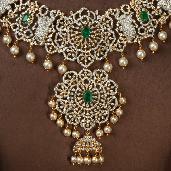 Close-up view of handcrafted designer 92.5 silver cz emerald necklace with premium cz embellishments, elephant motifs. Perfect for bridal wear, festive occasions, weddings, and traditional ethnic styling.
Sri fine jewellery, Hyderabad. 
