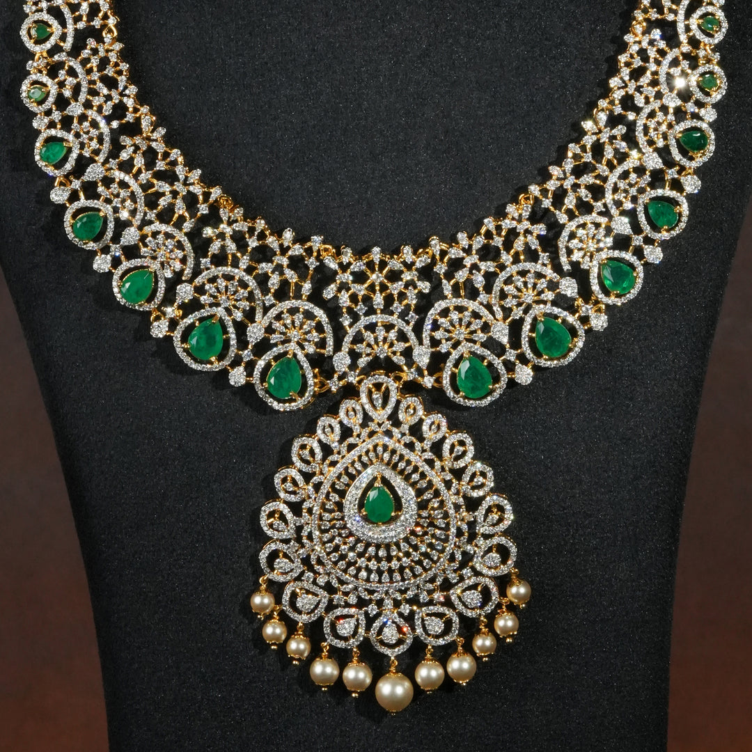 Close-up of luxury bridal necklace set in 92.5 silver with semi-precious emerald stones, antique finish and intricate design, handcrafted wedding jewellery for brides by Sri Fine Jewellery, Hyderabd(https://srifinejewellery.com)