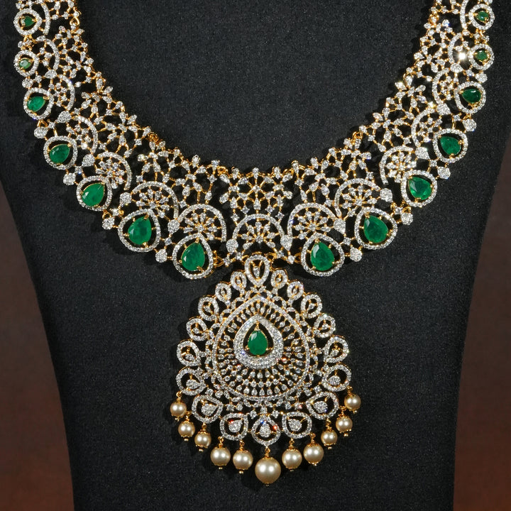 Close-up of luxury bridal necklace set in 92.5 silver with semi-precious emerald stones, antique finish and intricate design, handcrafted wedding jewellery for brides by Sri Fine Jewellery, Hyderabd(https://srifinejewellery.com)