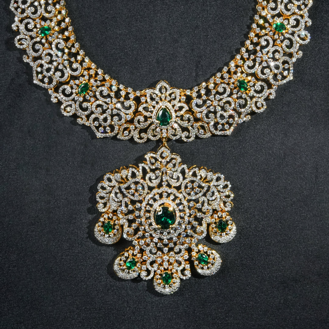 Close-up view of luxury bridal necklace set in 92.5 silver with semi-precious emerald stones, antique finish and intricate design, handcrafted wedding jewellery for brides by Sri Fine Jewellery, Hyderabd(https://srifinejewellery.com)