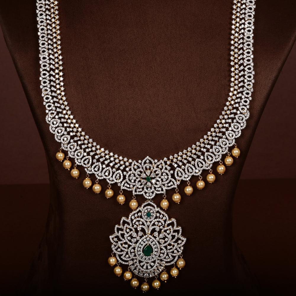 Close-up of luxury bridal necklace set in 92.5 silver with semi-precious emerald stones, antique finish and intricate design, handcrafted wedding jewellery for brides by Sri Fine Jewellery, Hyderabd(https://srifinejewellery.com)