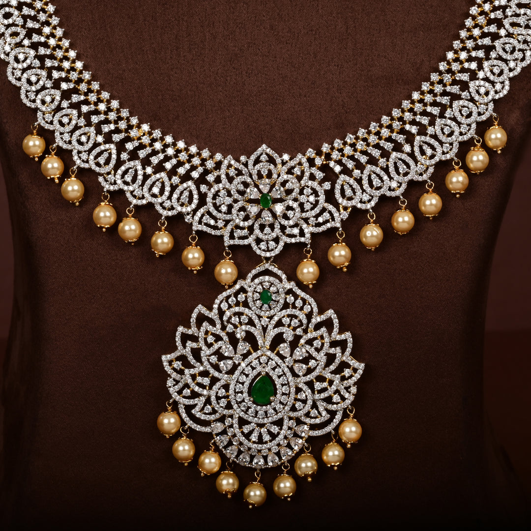 Close-up of luxury bridal necklace set in 92.5 silver with semi-precious emerald stones, antique finish and intricate design, handcrafted wedding jewellery for brides by Sri Fine Jewellery, Hyderabd(https://srifinejewellery.com)