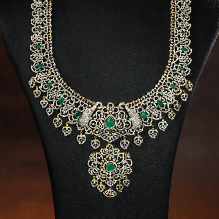 Close-up of luxury bridal necklace set in 92.5 silver with emerald green stones, antique finish and intricate design, handcrafted wedding jewellery for brides by Sri Fine Jewellery, Hyderabd(https://srifinejewellery.com)