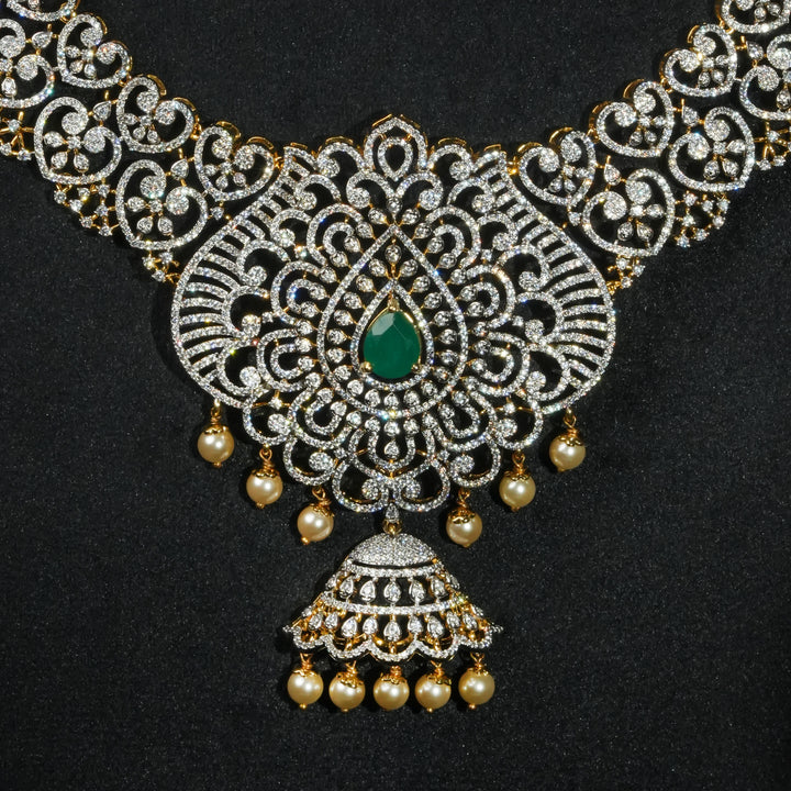 Close-up view luxury bridal necklace set in 92.5 silver with emerald green stones, antique finish and intricate design, handcrafted wedding jewellery for brides by Sri Fine Jewellery, Hyderabd(https://srifinejewellery.com)