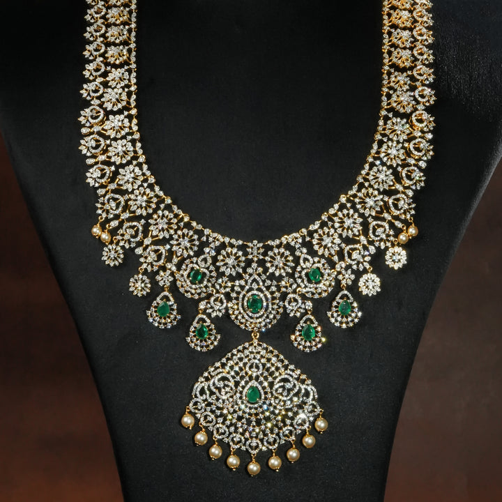 Close-up view luxury bridal necklace set in 92.5 silver with emerald green stones, antique finish and intricate design, handcrafted wedding jewellery for brides by Sri Fine Jewellery, Hyderabd(https://srifinejewellery.com)