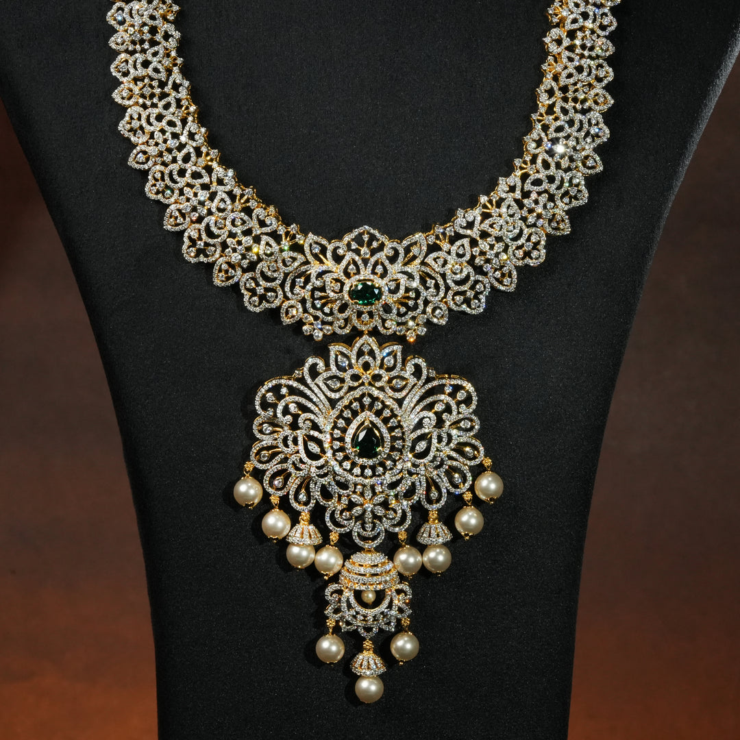 Close-up view luxury bridal necklace set in 92.5 silver with emerald green stones, antique finish and intricate design, handcrafted wedding jewellery for brides by Sri Fine Jewellery, Hyderabd(https://srifinejewellery.com)