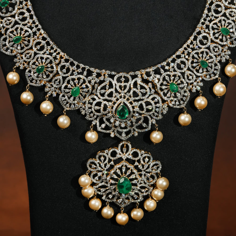 Close-up luxury bridal necklace set in 92.5 silver with emerald green stones, antique finish and intricate design, handcrafted wedding jewellery for brides by Sri Fine Jewellery, Hyderabd(https://srifinejewellery.com)