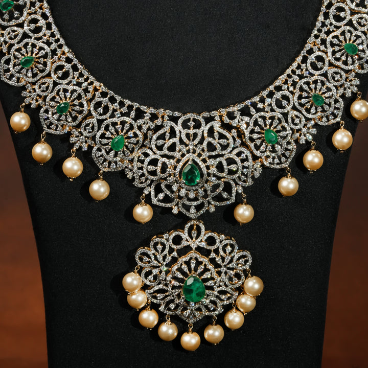 Close-up luxury bridal necklace set in 92.5 silver with emerald green stones, antique finish and intricate design, handcrafted wedding jewellery for brides by Sri Fine Jewellery, Hyderabd(https://srifinejewellery.com)
