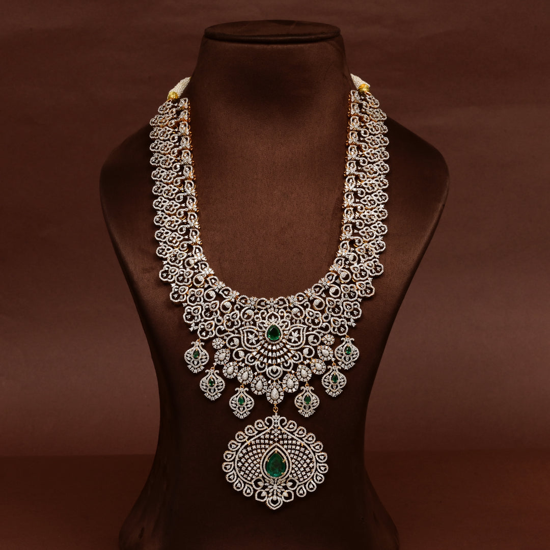 Luxury bridal necklace set in 92.5 silver with emerald green stones, antique finish and intricate floral design, handcrafted wedding jewellery for brides by Sri Fine Jewellery, Hyderabd(https://srifinejewellery.com)