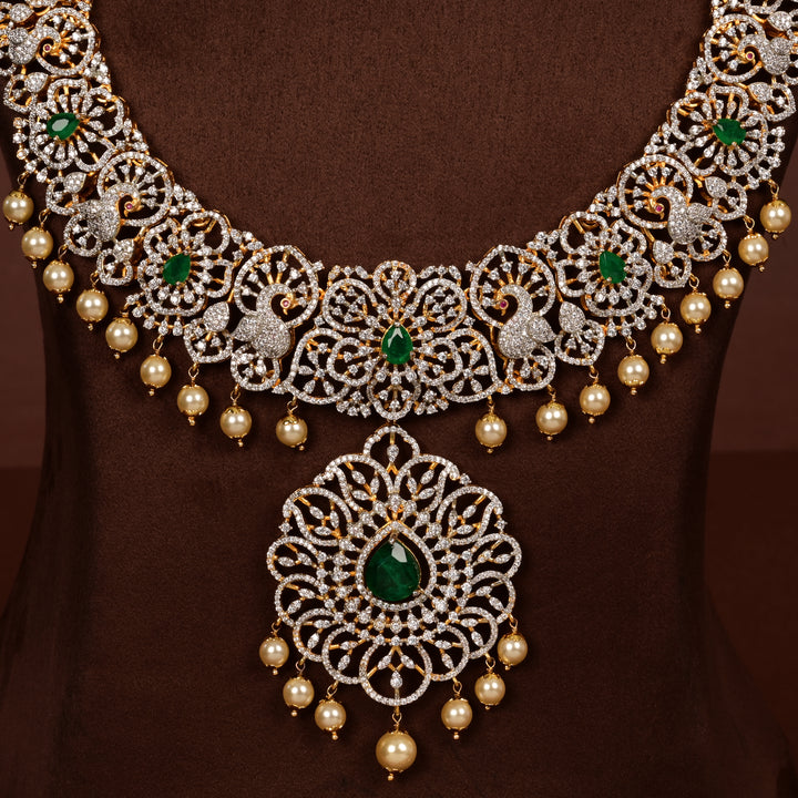 Close-up view of luxury bridal necklace set in 92.5 silver with emerald green stones, antique finish, peacock motifs and intricate victorian floral design, handcrafted wedding jewellery for brides by Sri Fine Jewellery, Hyderabd(https://srifinejewellery.com)
