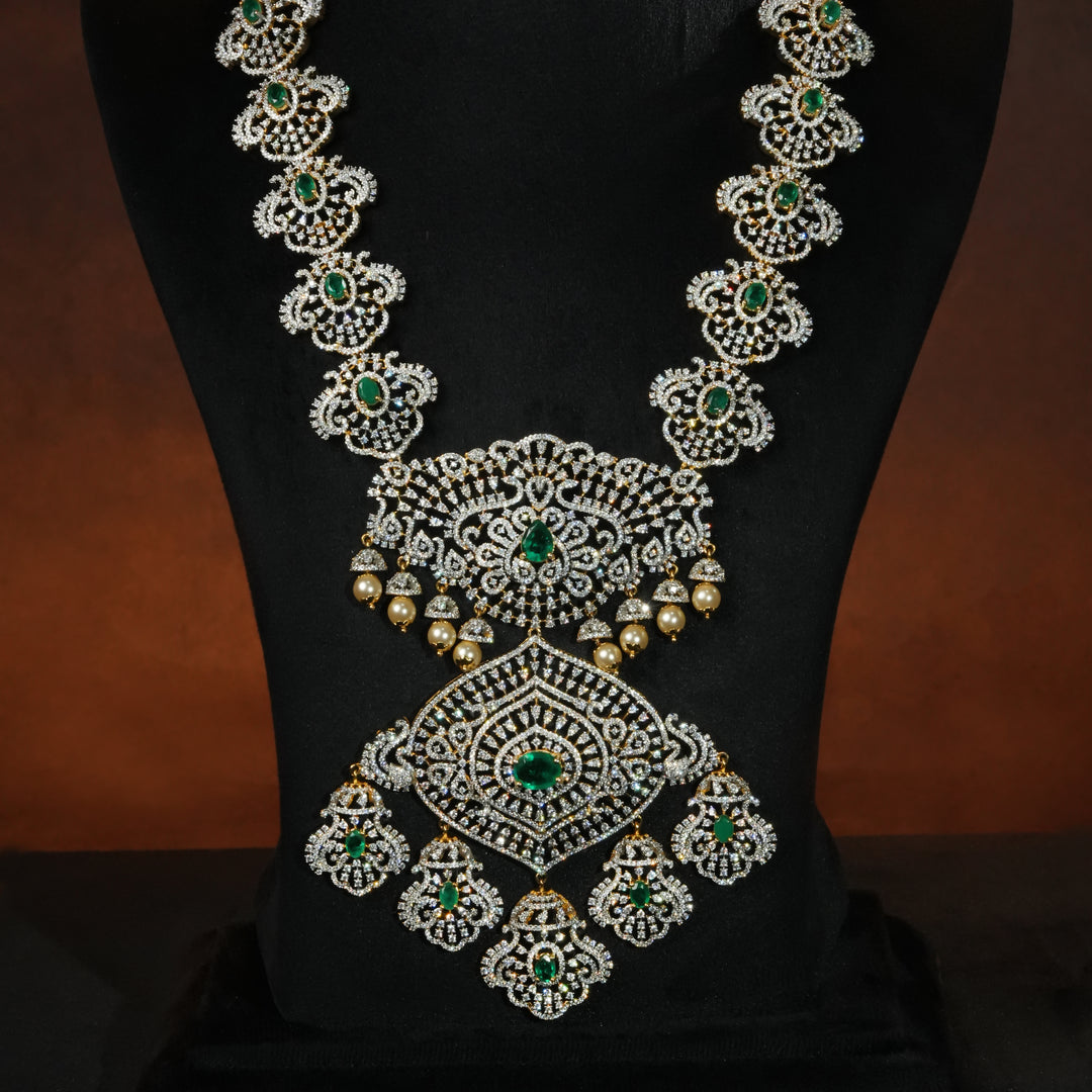 Luxury bridal necklace set in 92.5 silver with emerald green stones, antique finish and intricate victorian floral design, handcrafted wedding jewellery for brides by Sri Fine Jewellery, Hyderabd(https://srifinejewellery.com)