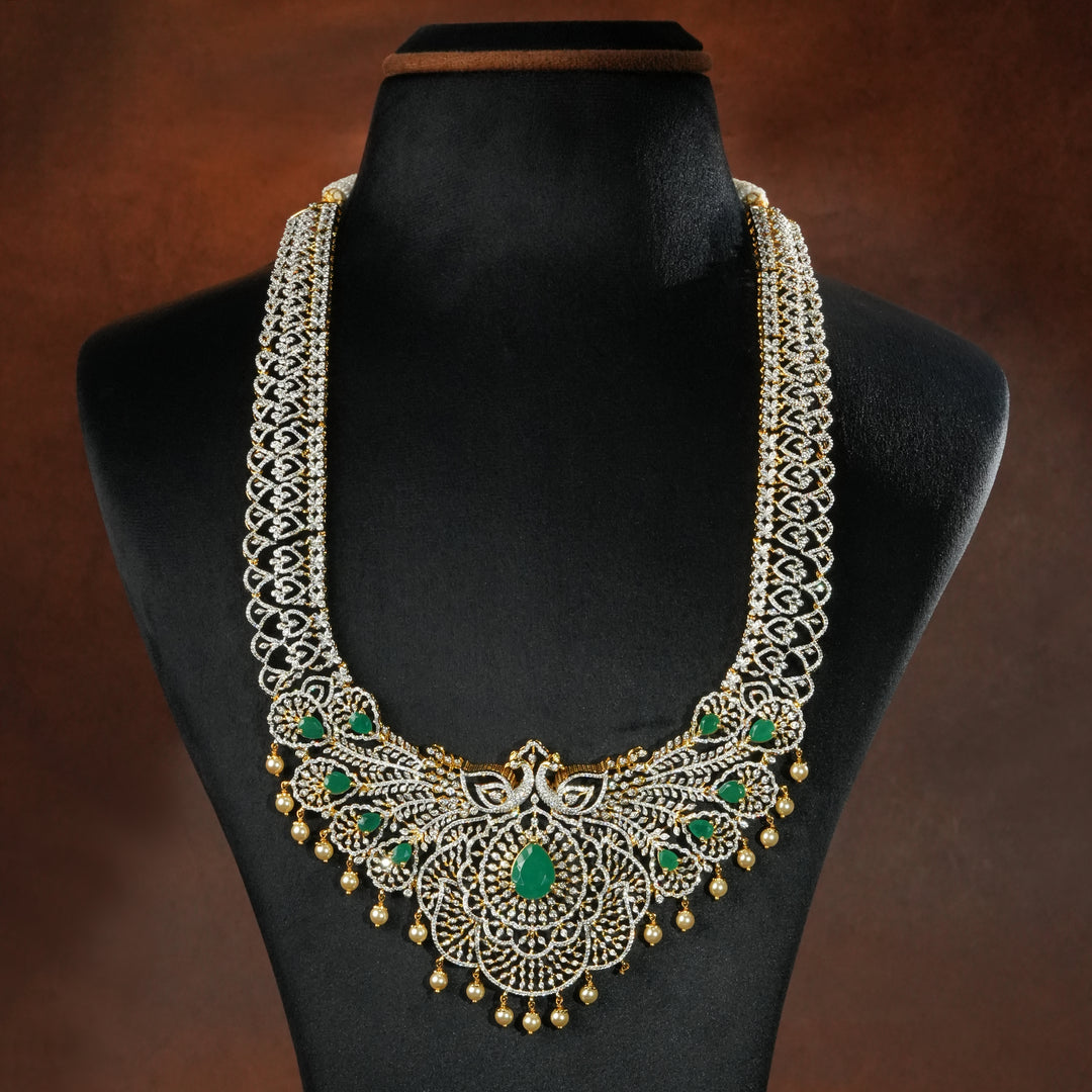 Full view of premium 92.5 silver cz emerald necklace with peacock motifs, intricate detailing and pearl drops by Sri Fine Jewellery, Hyderabd(https://srifinejewellery.com)