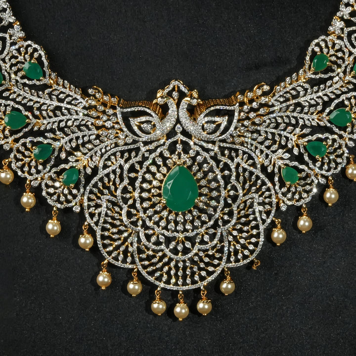 Close-up view of premium 92.5 silver cz remerald necklace with peacock motifs, intricate detailing and pearl drops by Sri Fine Jewellery, Hyderabd(https://srifinejewellery.com)
