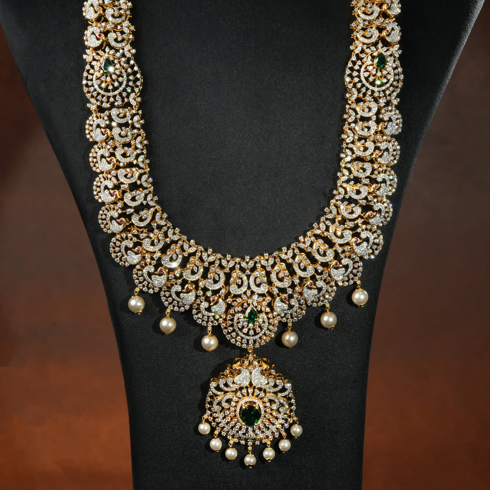 Premium 92.5 silver cz emerald necklace with peacock motifs, intricate detailing and pearl drops by Sri Fine Jewellery, Hyderabd(https://srifinejewellery.com)