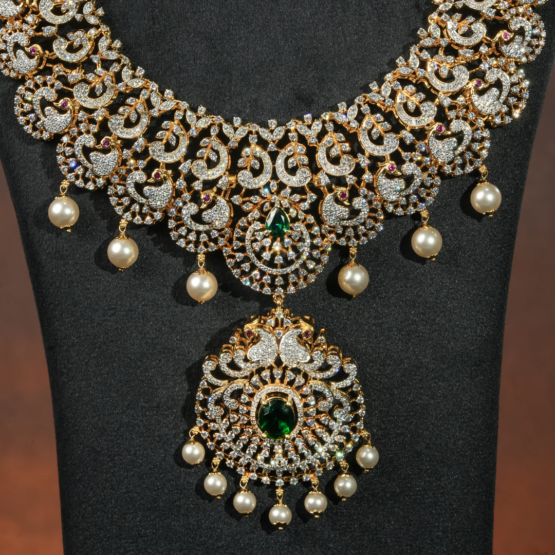Close-up view of premium 92.5 silver cz emerald necklace with peacock motifs, intricate detailing and pearl drops by Sri Fine Jewellery, Hyderabd(https://srifinejewellery.com)