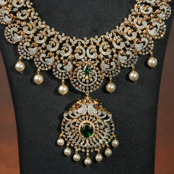 Close-up view of premium 92.5 silver cz emerald necklace with peacock motifs, intricate detailing and pearl drops by Sri Fine Jewellery, Hyderabd(https://srifinejewellery.com)