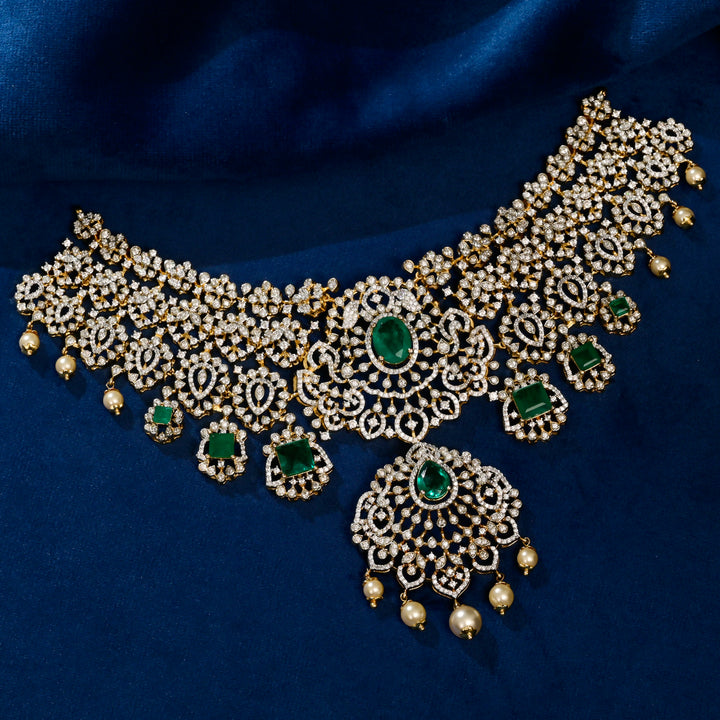 silver cz choker with semi-precious emerald gemstones on a blue fabric background by sri fine jewellery hyderabad