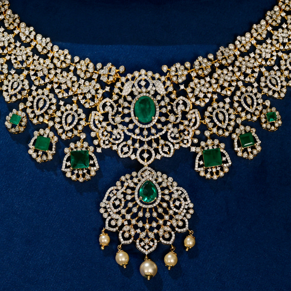 silver cz choker with semi-precious emerald gemstones close-up on a blue fabric background by sri fine jewellery hyderabad