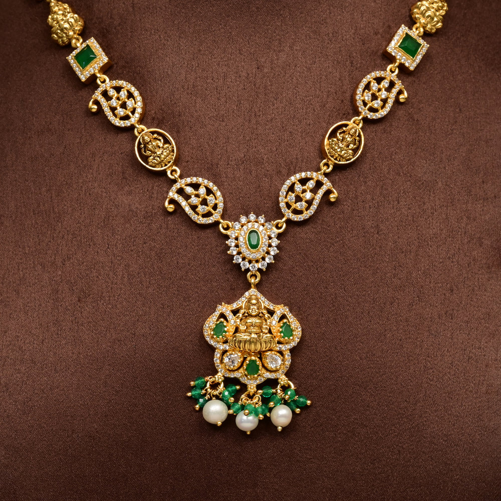 Close-up traditional 92.5 silver temple necklace with Lakshmi motifs, emerald stone detailing, and intricate heritage craftsmanship by Sri Fine Jewellery Hyderabad (https://srifinejewellery.com)