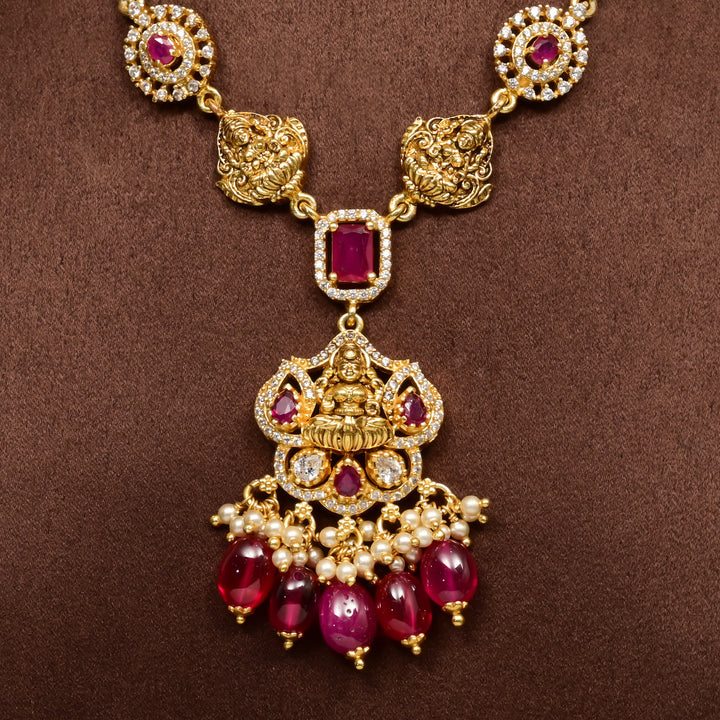 Close-up of traditional 92.5 silver temple necklace with Lakshmi motifs, ruby stone detailing, and intricate heritage craftsmanship by Sri Fine Jewellery Hyderabad (https://srifinejewellery.com)