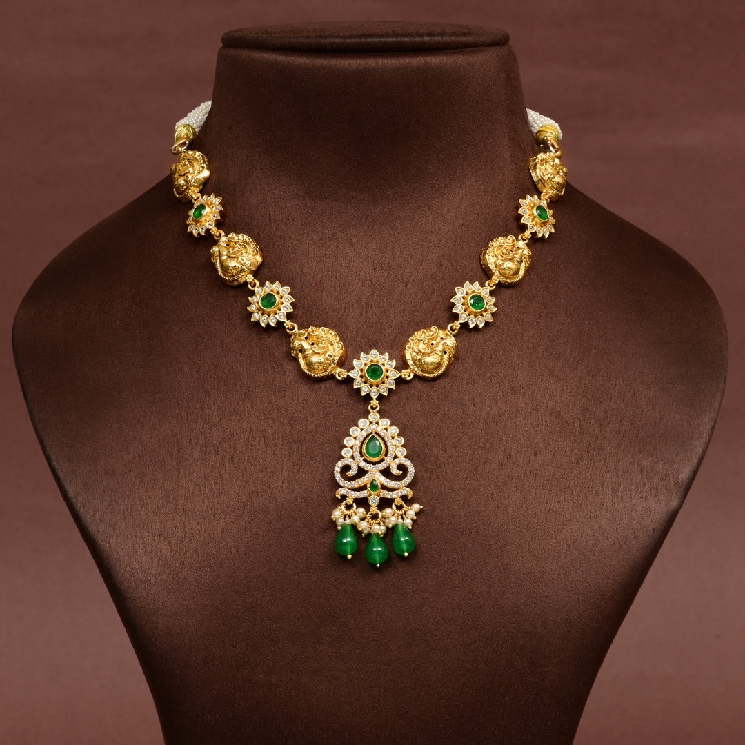 Traditional 92.5 silver temple necklace with Lakshmi and peacock motifs, emerald stone detailing, and intricate heritage craftsmanship by Sri Fine Jewellery Hyderabad (https://srifinejewellery.com)