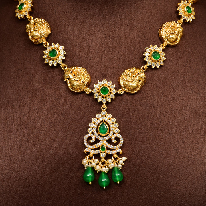 Traditional 92.5 silver temple necklace with Lakshmi and peacock motifs, emerald stone detailing, and intricate heritage craftsmanship by Sri Fine Jewellery Hyderabad (https://srifinejewellery.com)