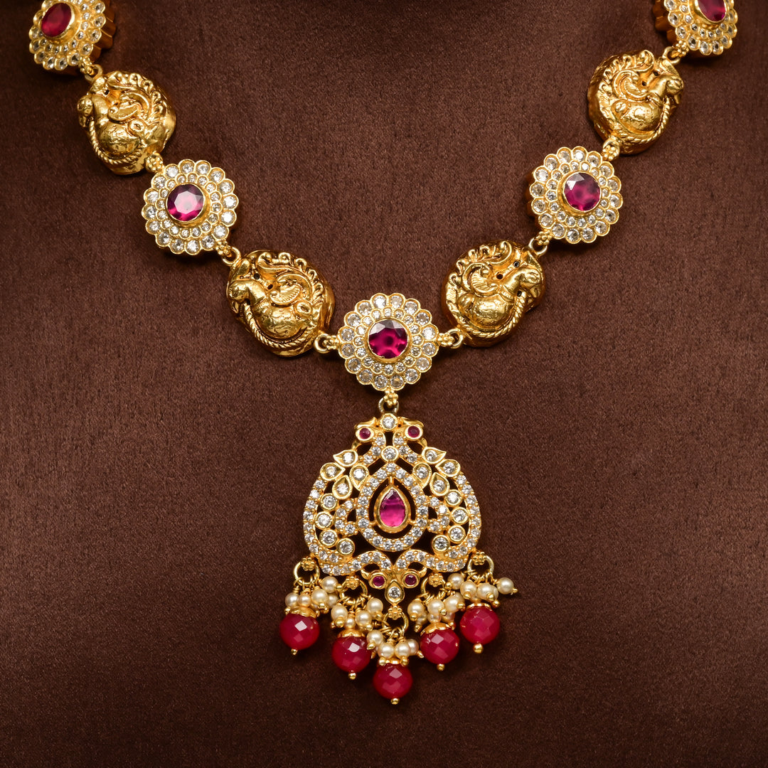 Traditional 92.5 silver temple necklace with peacock motifs, ruby stone detailing, and intricate heritage craftsmanship by Sri Fine Jewellery Hyderabad (https://srifinejewellery.com)
