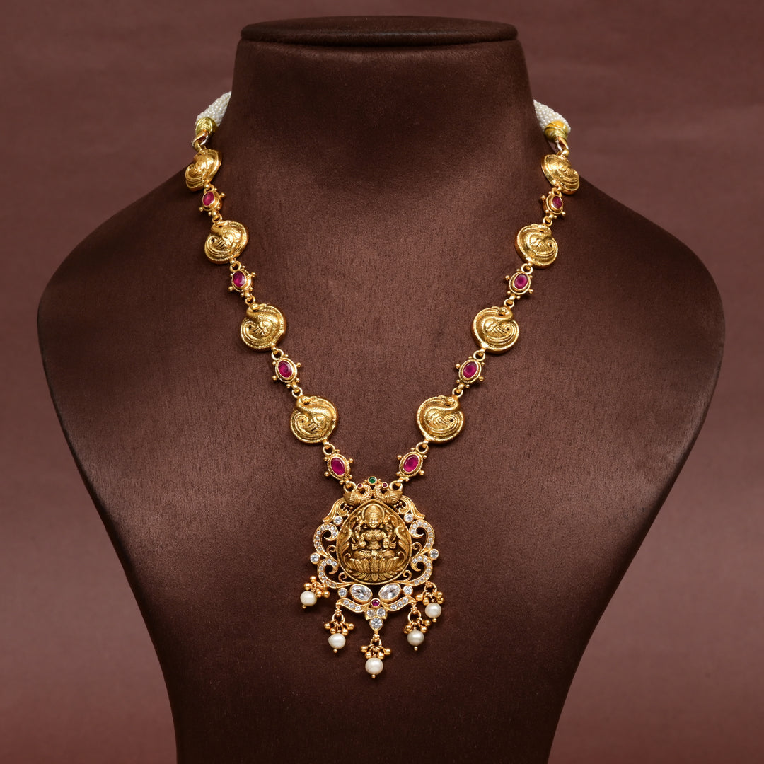 Traditional 92.5 silver temple necklace with Lakshmi and peacock motifs, ruby stone detailing, and intricate heritage craftsmanship by Sri Fine Jewellery Hyderabad (https://srifinejewellery.com)