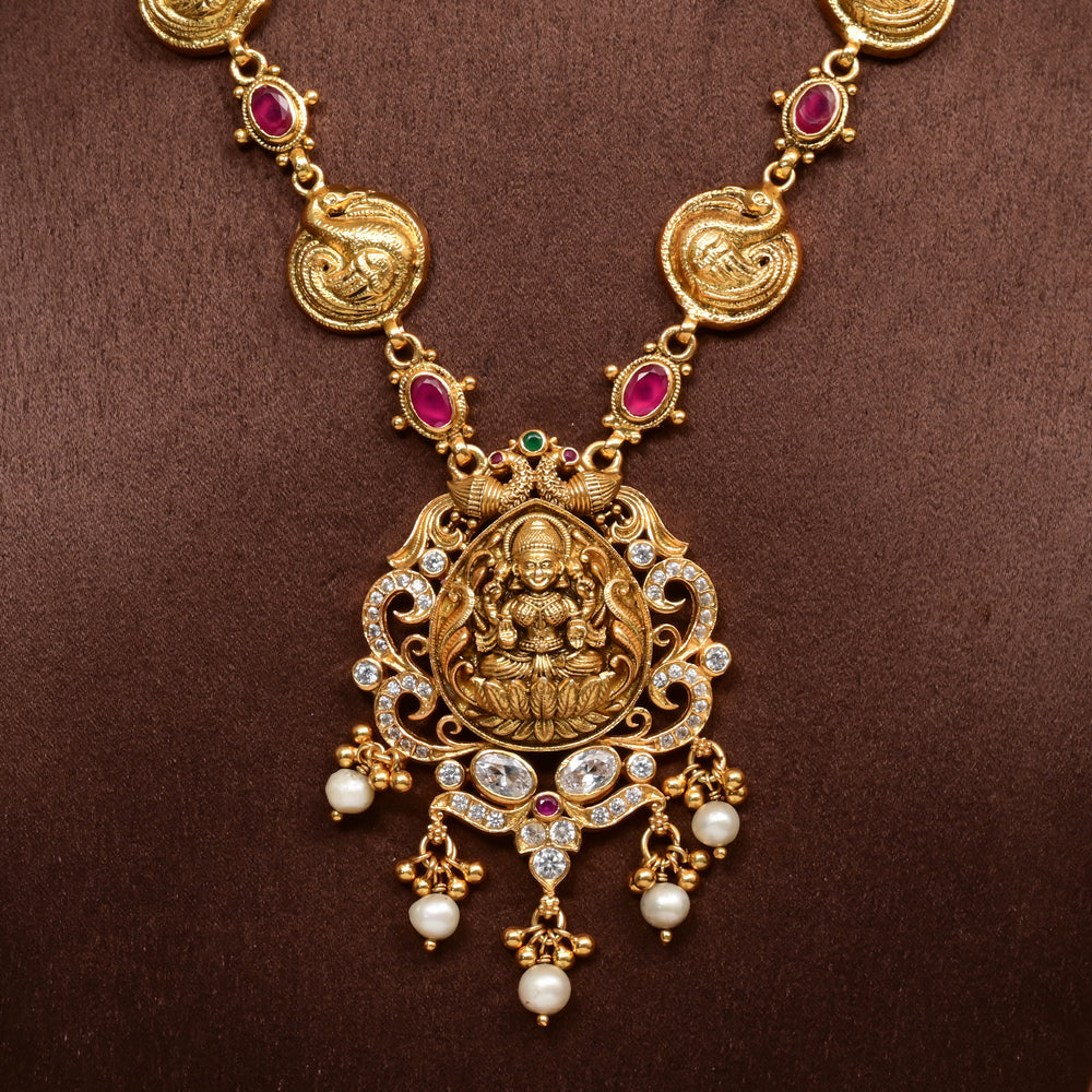 Traditional 92.5 silver temple necklace with Lakshmi and peacock motifs, ruby stone detailing, and intricate heritage craftsmanship by Sri Fine Jewellery Hyderabad (https://srifinejewellery.com)