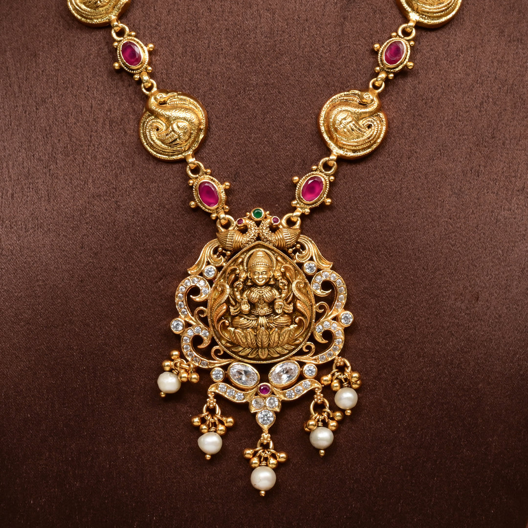 Traditional 92.5 silver temple necklace with Lakshmi and peacock motifs, ruby stone detailing, and intricate heritage craftsmanship by Sri Fine Jewellery Hyderabad (https://srifinejewellery.com)