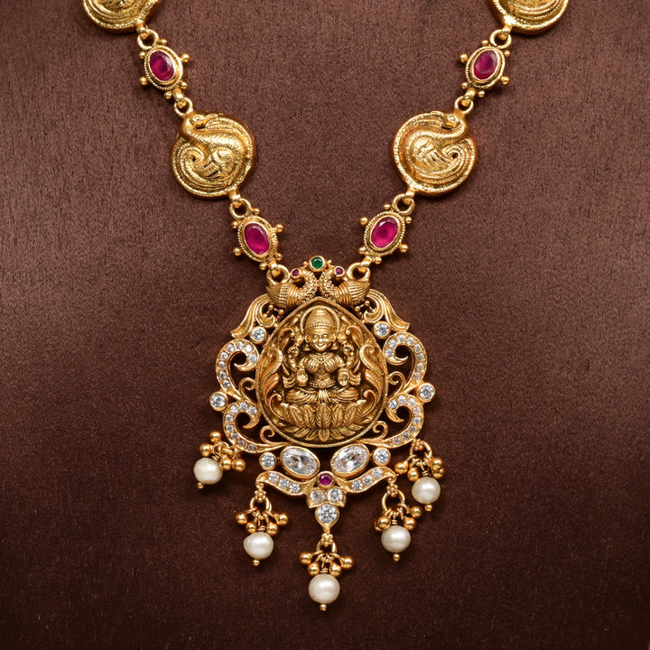 Traditional 92.5 silver temple necklace with Lakshmi and peacock motifs, ruby stone detailing, and intricate heritage craftsmanship by Sri Fine Jewellery Hyderabad (https://srifinejewellery.com)