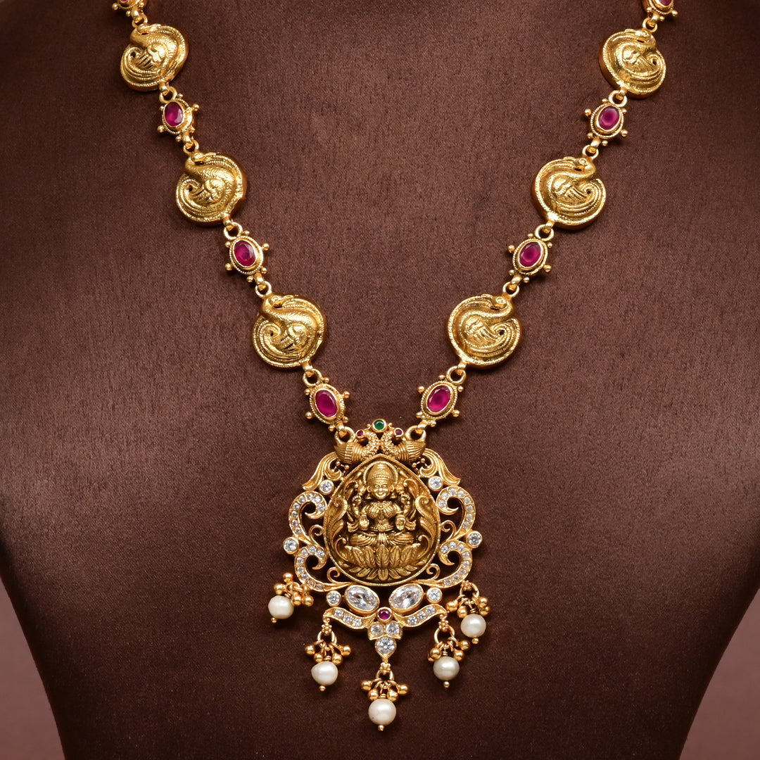 Traditional 92.5 silver temple necklace with Lakshmi and peacock motifs, ruby stone detailing, and intricate heritage craftsmanship by Sri Fine Jewellery Hyderabad (https://srifinejewellery.com)