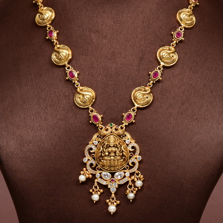 Traditional 92.5 silver temple necklace with Lakshmi and peacock motifs, ruby stone detailing, and intricate heritage craftsmanship by Sri Fine Jewellery Hyderabad (https://srifinejewellery.com)
