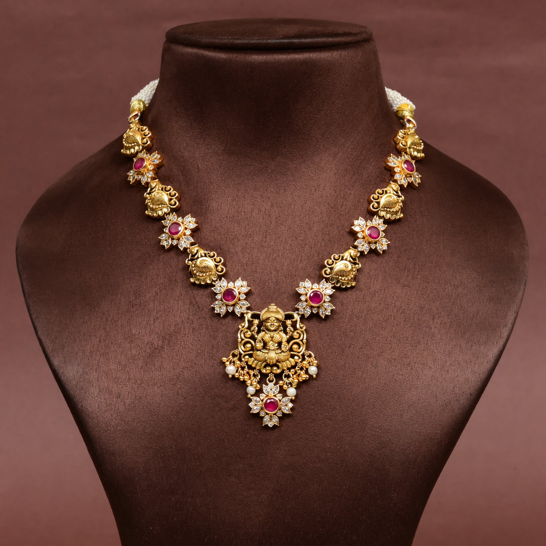 Traditional 92.5 silver temple necklace with Lakshmi and floral motifs, ruby stone detailing, and intricate heritage craftsmanship by Sri Fine Jewellery Hyderabad (https://srifinejewellery.com)