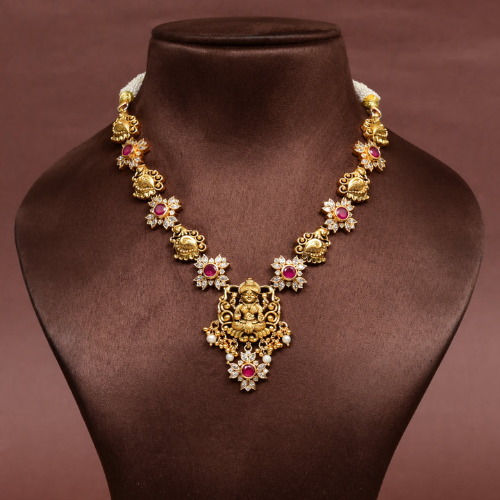 Traditional 92.5 silver temple necklace with Lakshmi and floral motifs, ruby stone detailing, and intricate heritage craftsmanship by Sri Fine Jewellery Hyderabad (https://srifinejewellery.com)