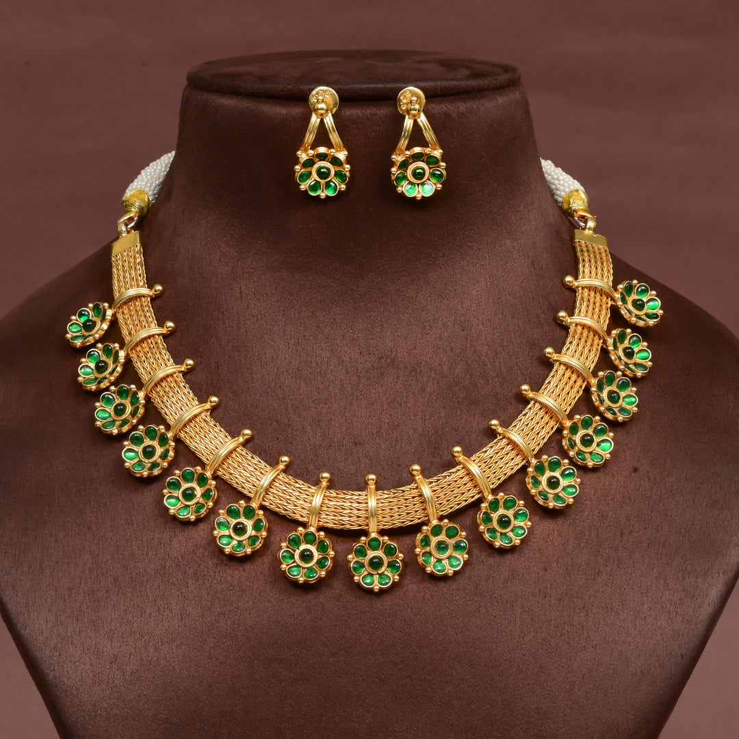 Traditional 92.5 silver temple necklace set with floral motifs, emerald stone detailing, and intricate heritage craftsmanship by Sri Fine Jewellery Hyderabad (https://srifinejewellery.com)