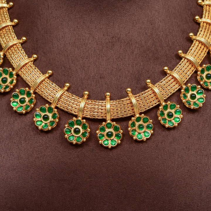 Traditional 92.5 silver temple necklace set with floral motifs, emerald stone detailing, and intricate heritage craftsmanship by Sri Fine Jewellery Hyderabad (https://srifinejewellery.com)