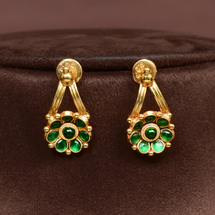 Traditional 92.5 silver earrings with floral motifs, emerald stone detailing, and intricate heritage craftsmanship by Sri Fine Jewellery Hyderabad (https://srifinejewellery.com)