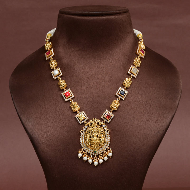 92.5 silver temple necklace with Lakshmi pendant, multicolor stones, pearl drops, and antique gold finish — perfect for bridal and festive wear.
Sri fine jewellery, Hyderabad 