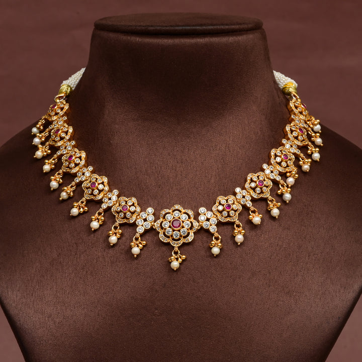 92.5 silver floral necklace with cz stones, ruby accents, pearl drops, and gold finish design by Sri Fine Jewellery Hyderabad.
