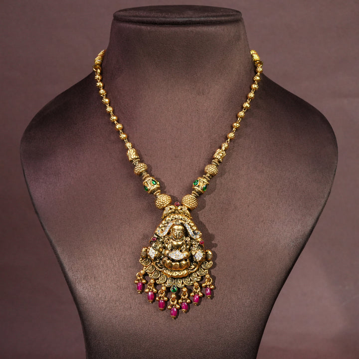 92.5 silver temple necklace with Lakshmi pendant, cz stone accents, antique gold finish, and traditional South Indian bridal jewellery design by Sri Fine Jewellery Hyderabad.
